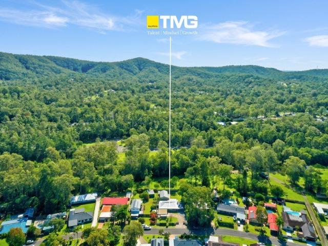 DUAL LIVING RETREAT ON 1,500M2  BACKING ONTO PARKLAND MUST BE SOLD