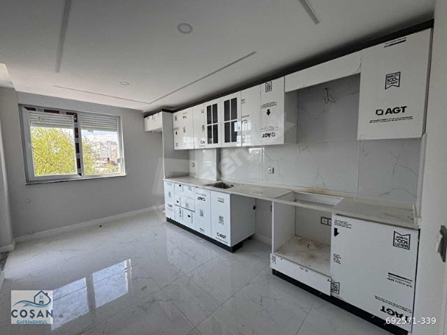 Düden Şelalesi yolu üzeri ana cadde kenarı satılık 2 + 1 daire