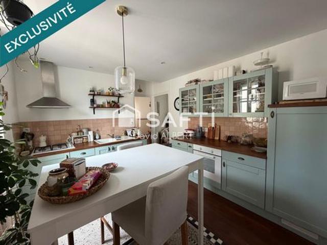 Duplex de caractère avec garage à deux pas du centre ville