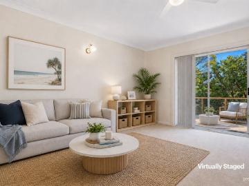 Easy Care Coastal Living in Sought After Blue Chip Locale
