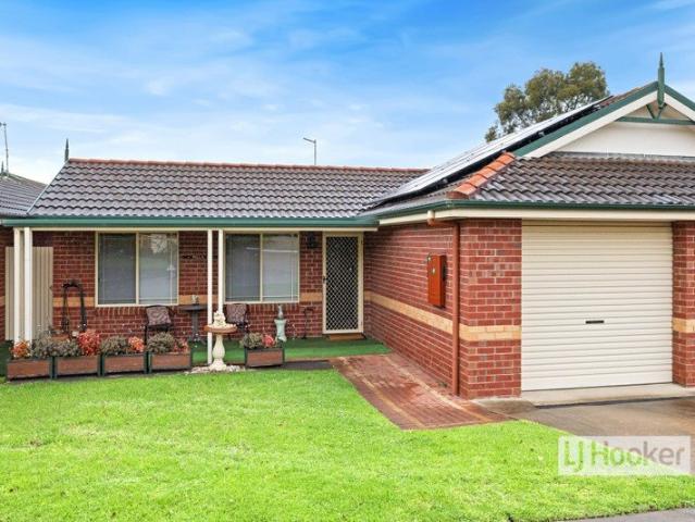 EASY CARE LIVING WITH SUNNY NORTH FACING COURTYARD IN PARKRIDGE VILLAGE