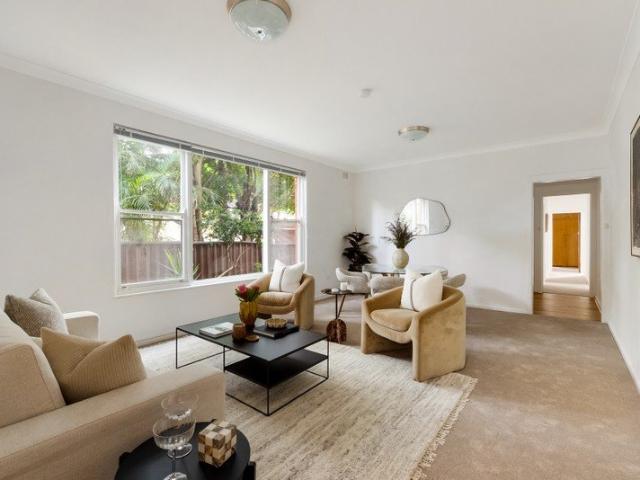 Easy care retreat with rare tandem garage