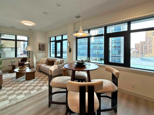 Eau Claire Residences — 1 Bed + Den Unit J