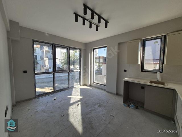 EGEPORTTAN ORTACA'DA BAHÇE NİZAM MÜLKİYETLİ 1+1 SATILIK DAİRE