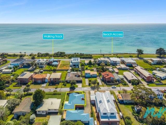 Effortless Coastal Living Just Steps From the Bay