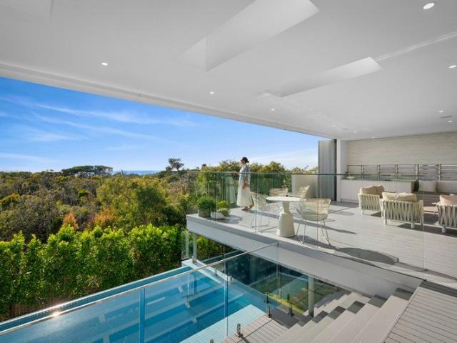 Effortless Coastal Luxury with Exclusive Beach Access in a Secure, Private Sanctuary