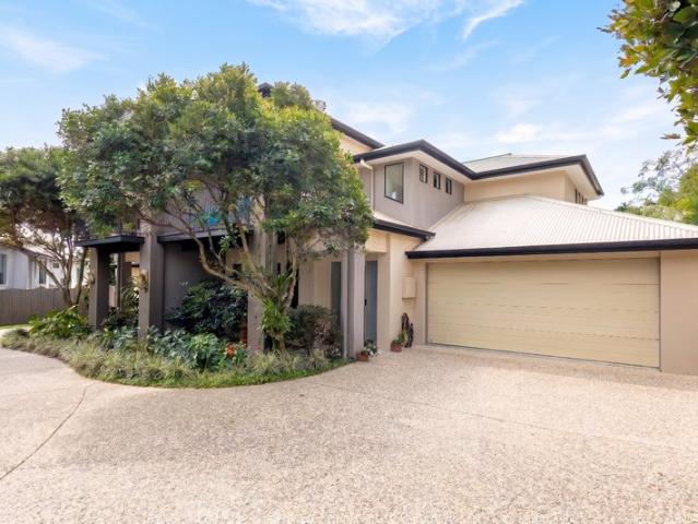 EFFORTLESS LOW MAINTENANCE LIVING WITH PREMIUM FINISHES IN A SOUGHT AFTER GATED COMPLEX!