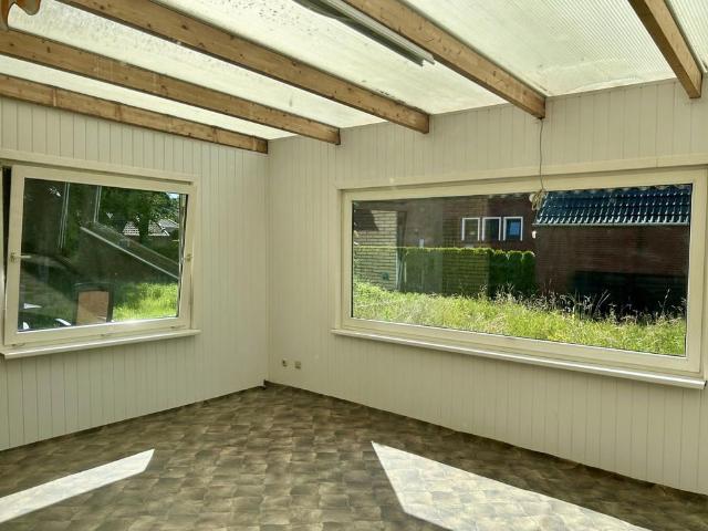 Ein frisch saniertes Wohlfühlzuhause mit Wintergarten und eigenem Garten!