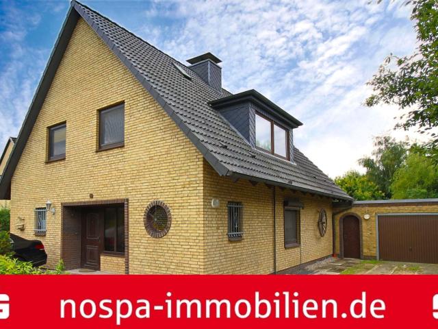 Einfamilienhaus mit Garage, 3 Pkw Stellplätzen und Terrasse in Kropp