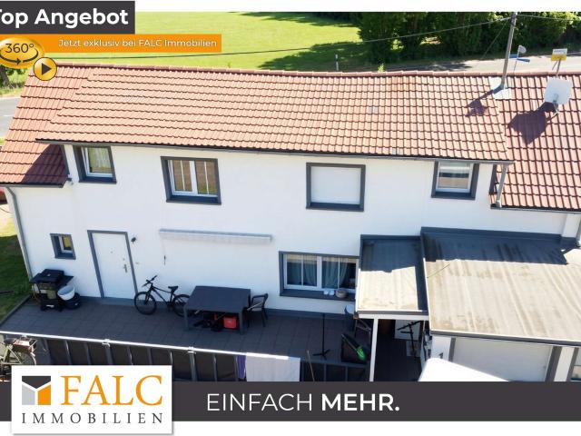 Einfamilienhaus mit Garten, drei Garagen und umfangreichen Modernisierungen