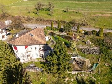 Einfamilienhaus mit grossem Grundstück & angrenzender Landwirtschaftsparzelle