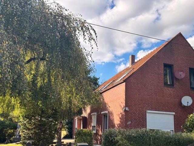 Eigentumswohnung mit Doppelhaus Charakter und Garten