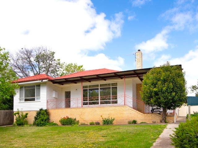 Elevated 1950s Elegance with Exceptional Garaging