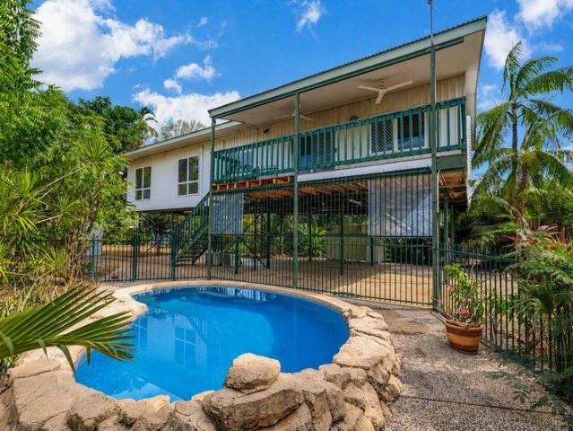 ELEVATED TROPICAL LIVING WITH RESORT STYLE POOL & BREEZES