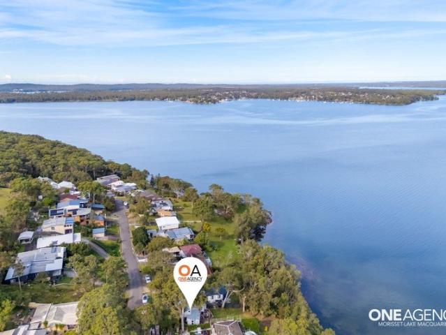 Elevated water views across exclusive Sugar Bay with direct lake access!