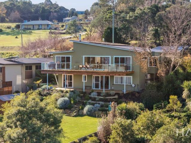 Elevated Waterfront Living with Panoramic River Views