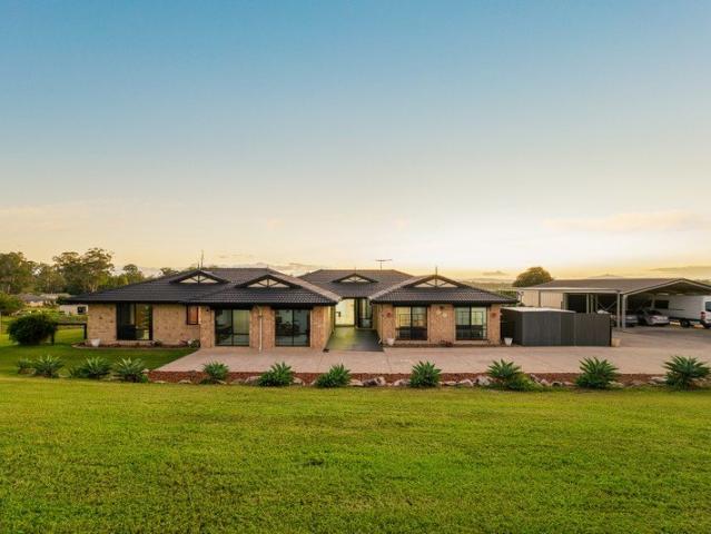 Elevated Acreage Entertainer Boasting Panoramic Mountain Views and Dual Living Potential