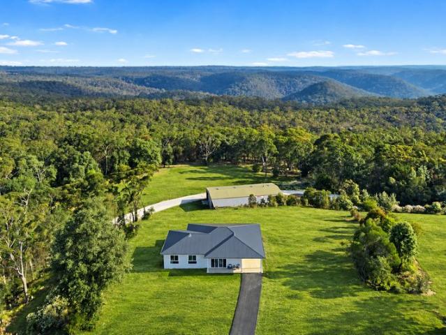 Elevated Acreage Living with Stunning Views & Shedding
