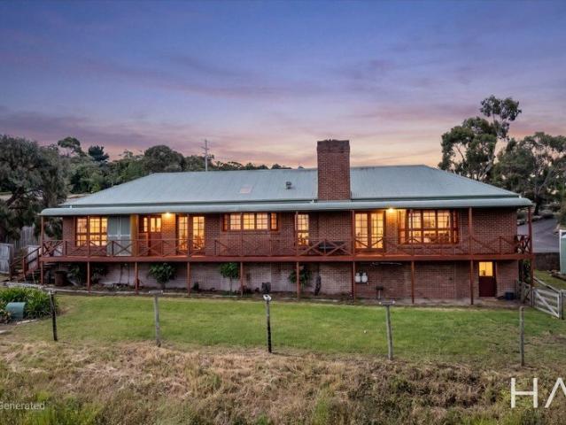 Elevated Acreage Living on One Level with Sweeping Views & Endless Entertaining Options