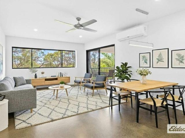 Elevated Apartment Living with Two Car Convenience