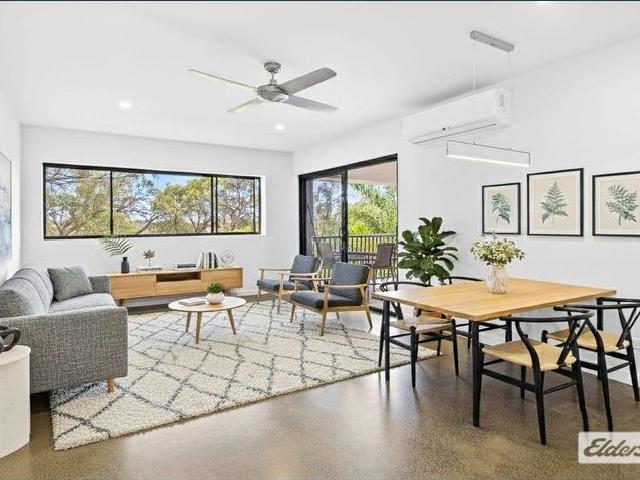 Elevated Apartment Living with Two Car Convenience