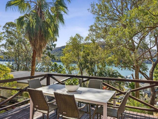 Elevated bay retreat with panoramic water views