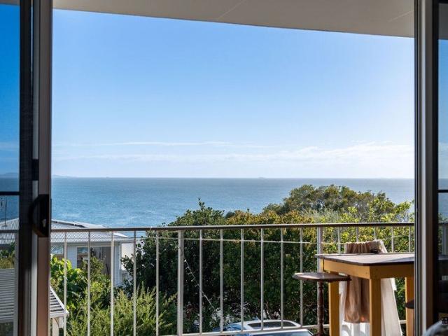 Elevated Beachside Living with Added Value