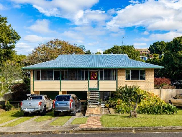 Elevated Brick Home Close to Schools, Shops and Main Street