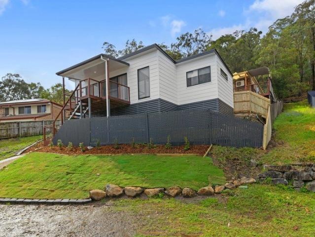 Elevated Carrara Living with Spacious Entertaining Deck Water Included!