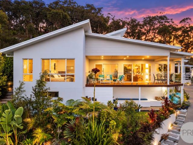 Elevated Coastal Masterpiece with Panoramic Water Views