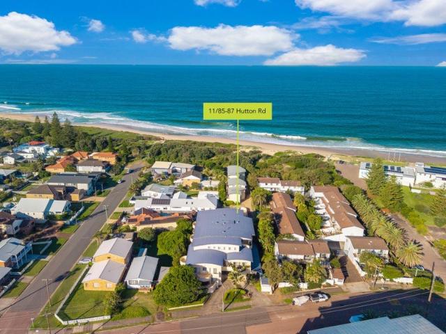 Elevated Coastal Apartment with Space, Style & Private Beach Access