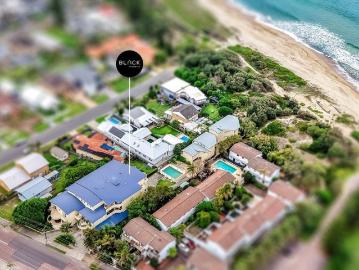 Elevated Coastal Apartment with Space, Style & Private Beach Access
