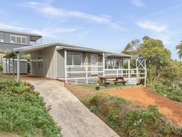 Elevated Coastal Charm with Lake Views & Future Potential