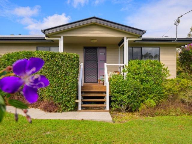 Elevated Coastal Living with Exceptional Vehicle Accommodation