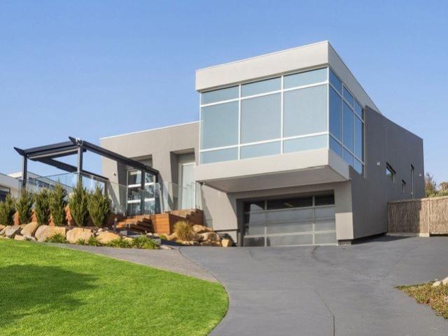 ELEVATED COASTAL LIVING WITH PANORAMIC VIEWS