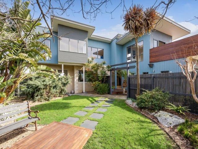 ELEVATED COASTAL LIVING WITH PANORAMIC OCEAN VIEWS!