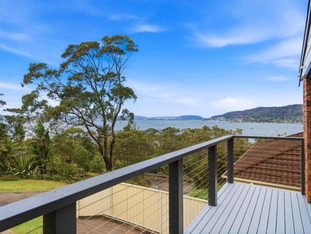 Elevated Coastal Living with Water Views and Space for the Whole Family