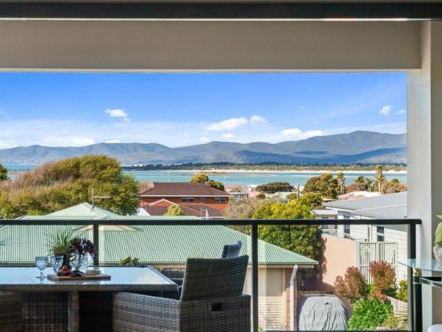 Elevated Coastal Living, Framed by Water and Mountain Views