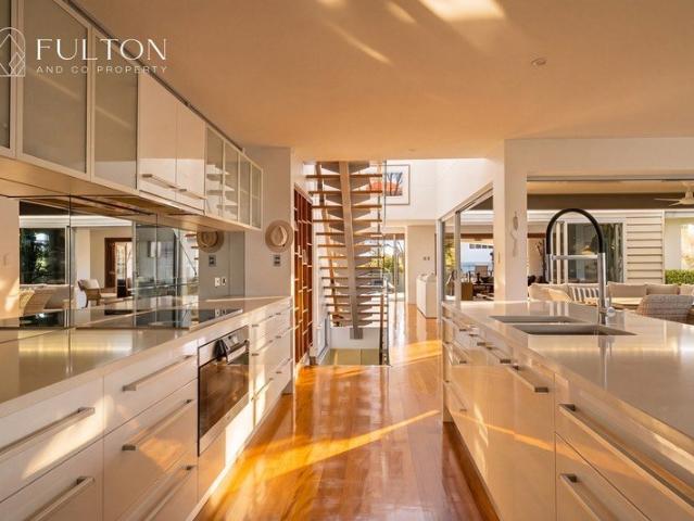 Elevated Coastal Living in One of Moffat Beach's Most Coveted Streets