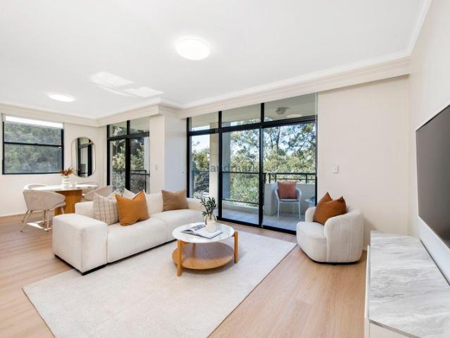 Elevated Corner Apartment with a Leafy Outlook and Abundance of Light
