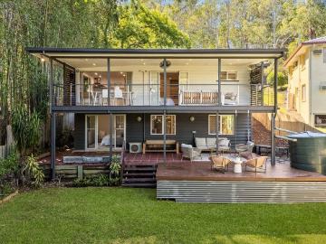 Elevated Entertainer with Expansive Deck & Flexible Split Level Living
