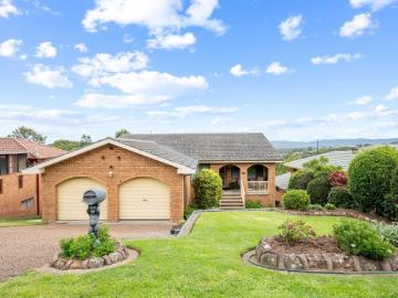 Elevated Family Home with Panoramic Lake Views and Endless Potential