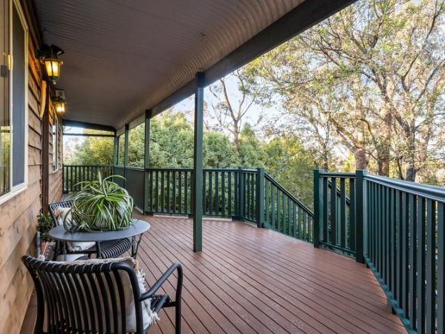 ELEVATED FAMILY HOME OFFERING VERSATILE SPACE AND PRIVACY