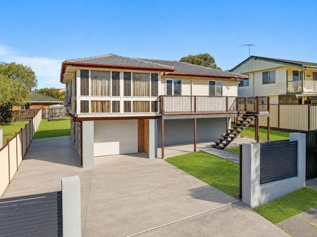 Elevated Family Living with Side Access & Endless Backyard Space