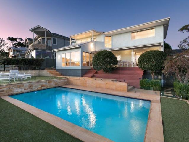 ELEVATED FAMILY LIVING WITH SWEEPING WATER VIEWS