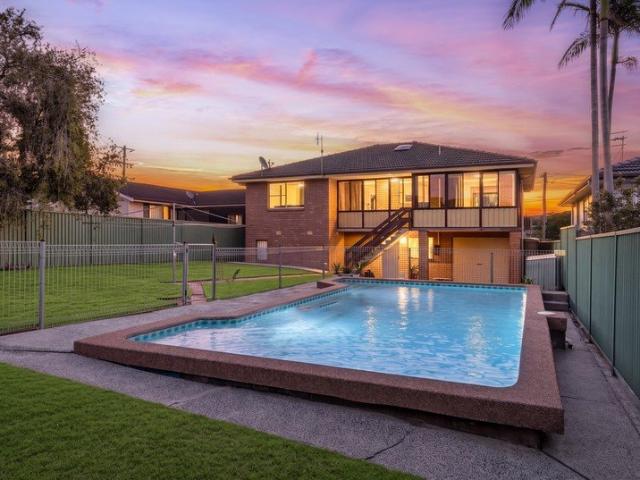 Elevated Family Living with Pool and Lake Outlook