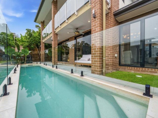 Elevated Family Luxury with Coastal Outlook & Tranquil Bushland Setting