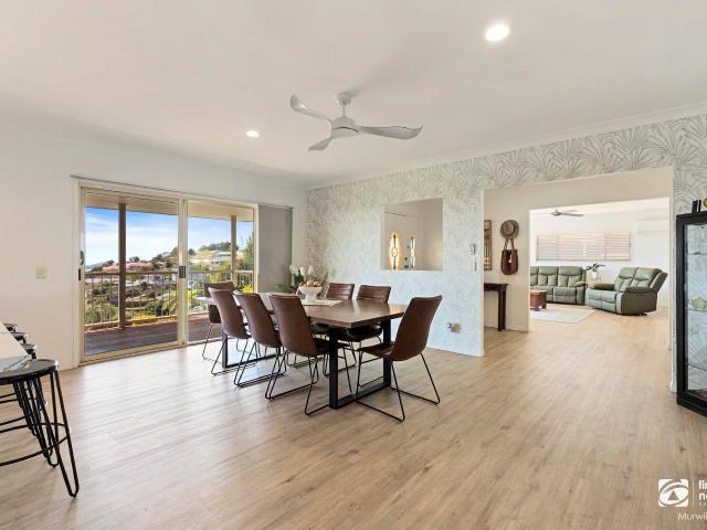 Elevated family sanctuary with coastal panoramas