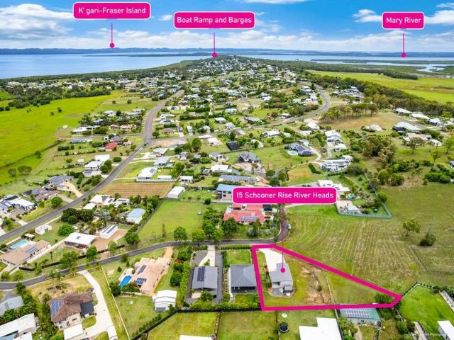 Elevated half acre block offering sea views with a fantastic shed!