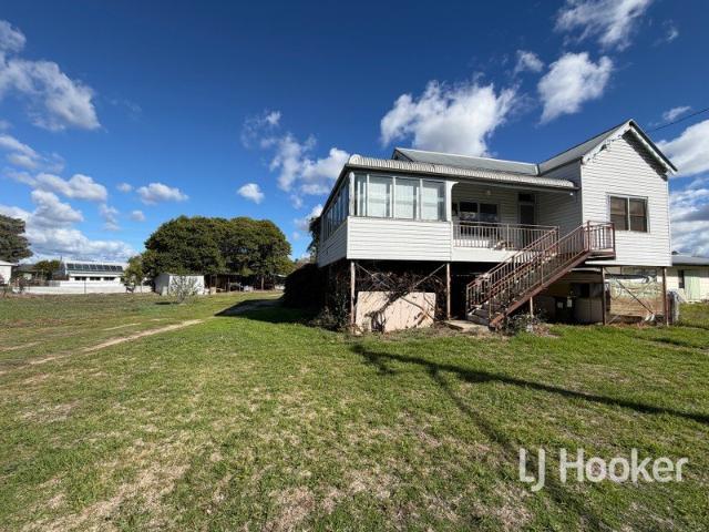 Elevated Home, Packed with Potential